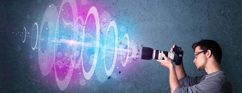 Photographer making photos with powerful light beam